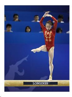 Girl balancing on balance beam