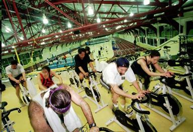 People on exercise bikes in a gym