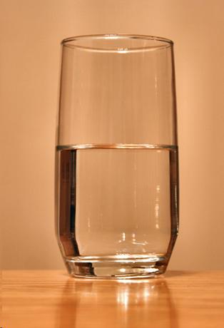 One glass of water sitting on a table