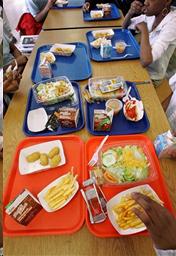 Table in cafeteria with school lunches.