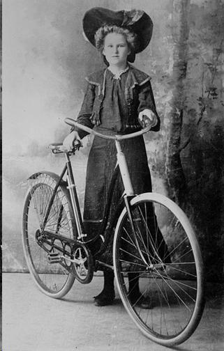 Amy Jorgensen of Charters Towers posing with a ladies' bicycle  